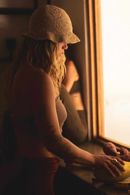 Hand-crocheted hemp floppy beach hat with wide brim in boho style