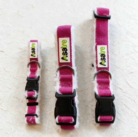 Hemp Dog Collar in bright pink woven webbing with white fleece lining, metal D-ring, and black plastic buckle