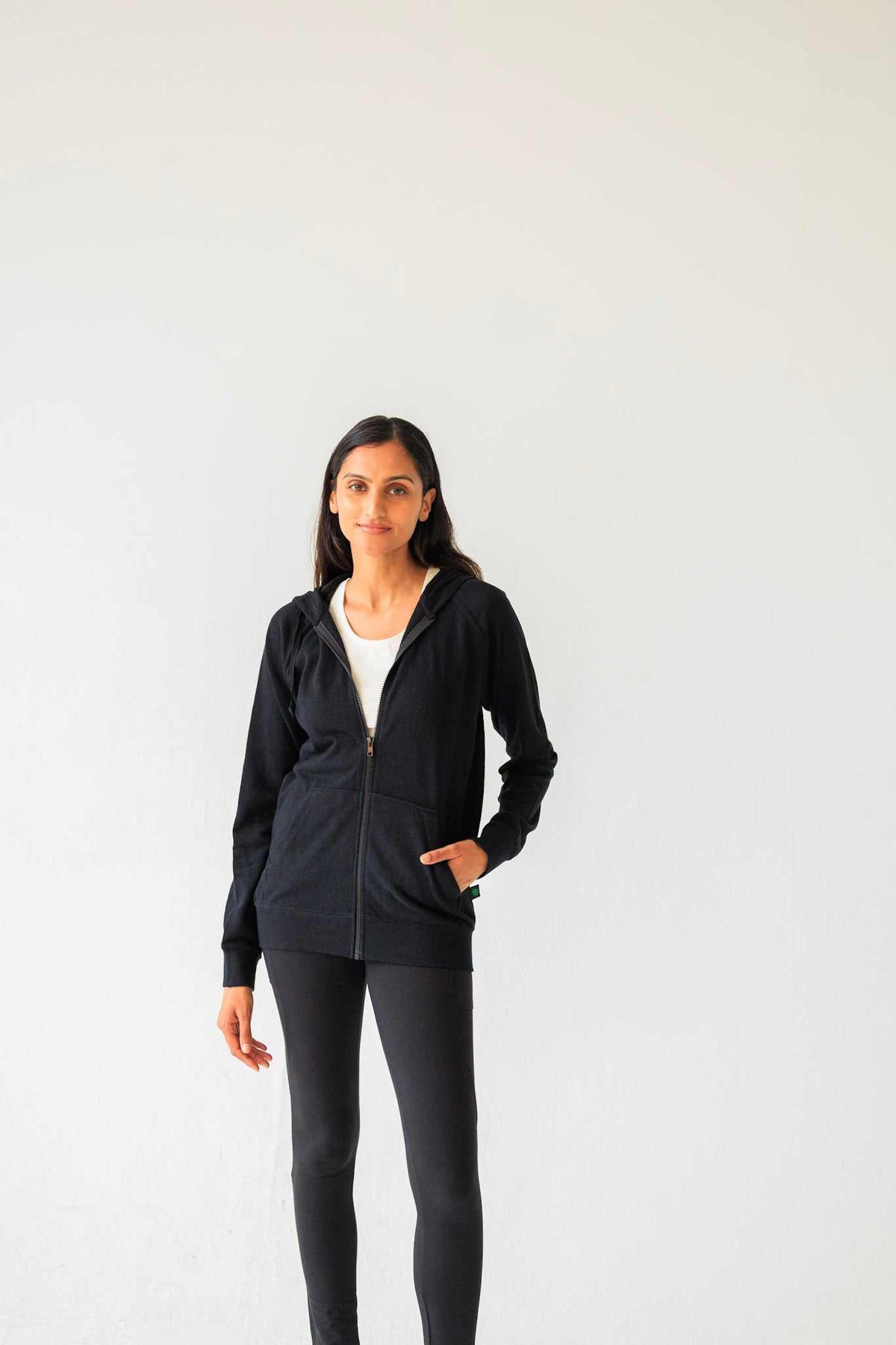 Hemp hoodie in black with a soft-looking solid fabric, full zip front, drawstring hood, and front pockets