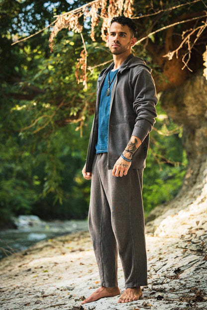 Hemp Hoodie in charcoal gray with a full front zipper, worn open over a blue shirt with matching relaxed pants