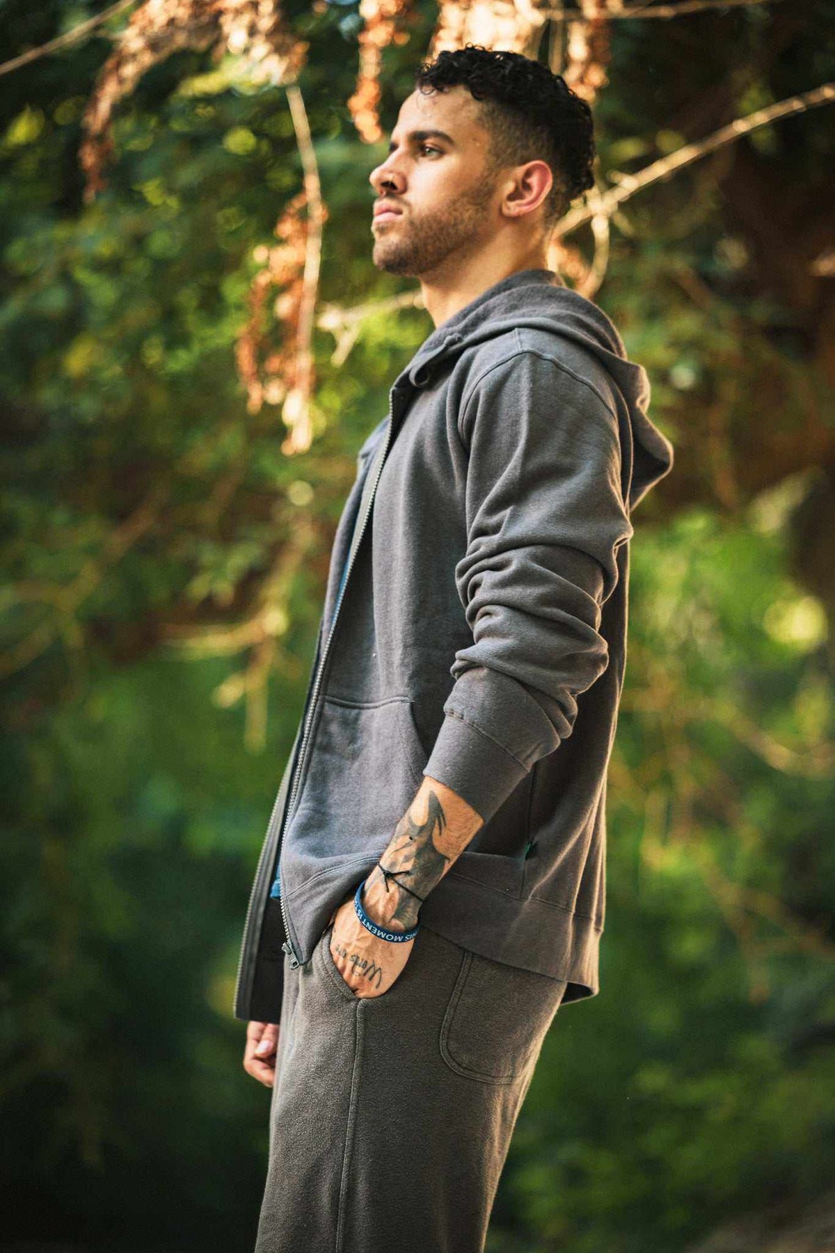 Hemp Hoodie in charcoal gray, soft-looking fabric with a full front zipper, drawstring hood, and front pockets