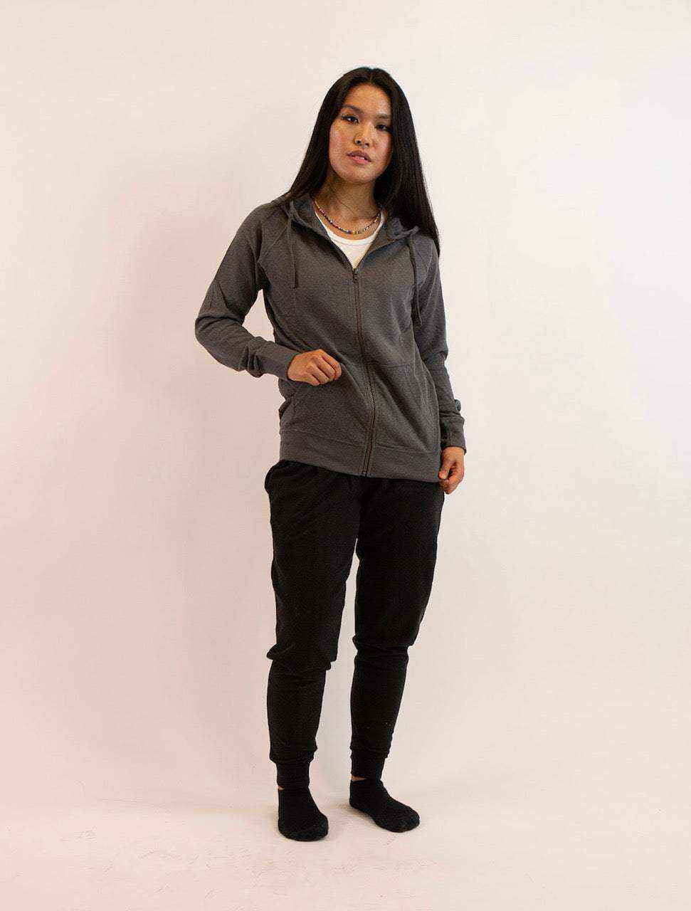 Hemp hoodie in dark charcoal gray with a soft jersey texture, full front zip, drawstring hood and front pockets