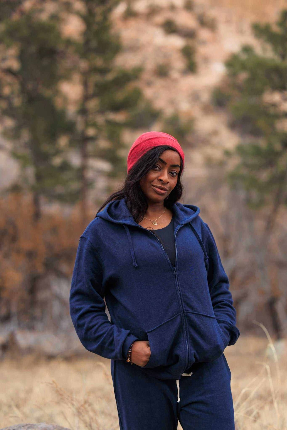 Hemp Hoodie in navy blue with a soft-looking fabric, full front zipper, drawstring hood, and front pockets