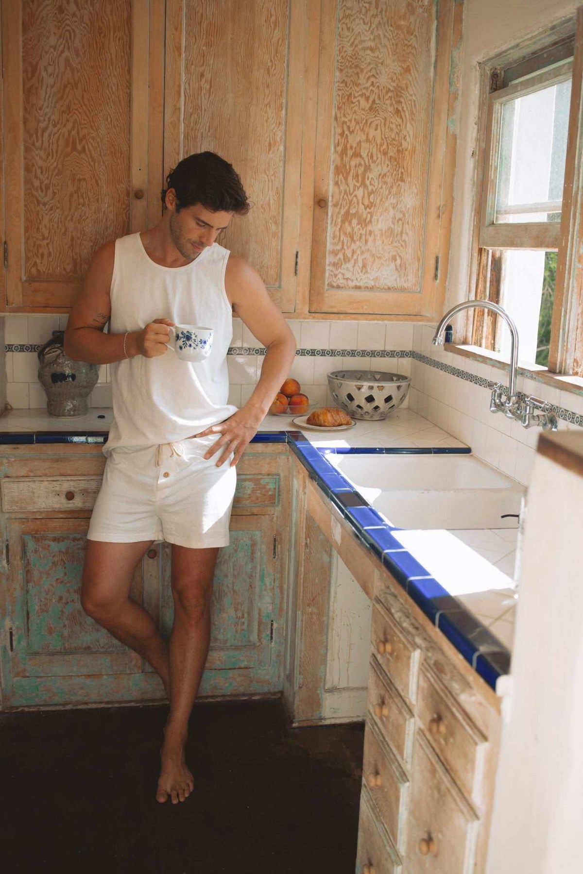 Hemp Tank Top in white sleeveless jersey, worn with matching white shorts for a simple, lightweight look