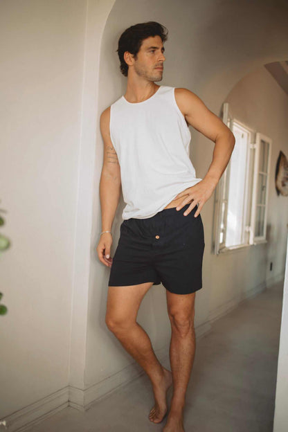 Hemp Tank Top in white sleeveless jersey with a classic muscle cut, worn with black shorts