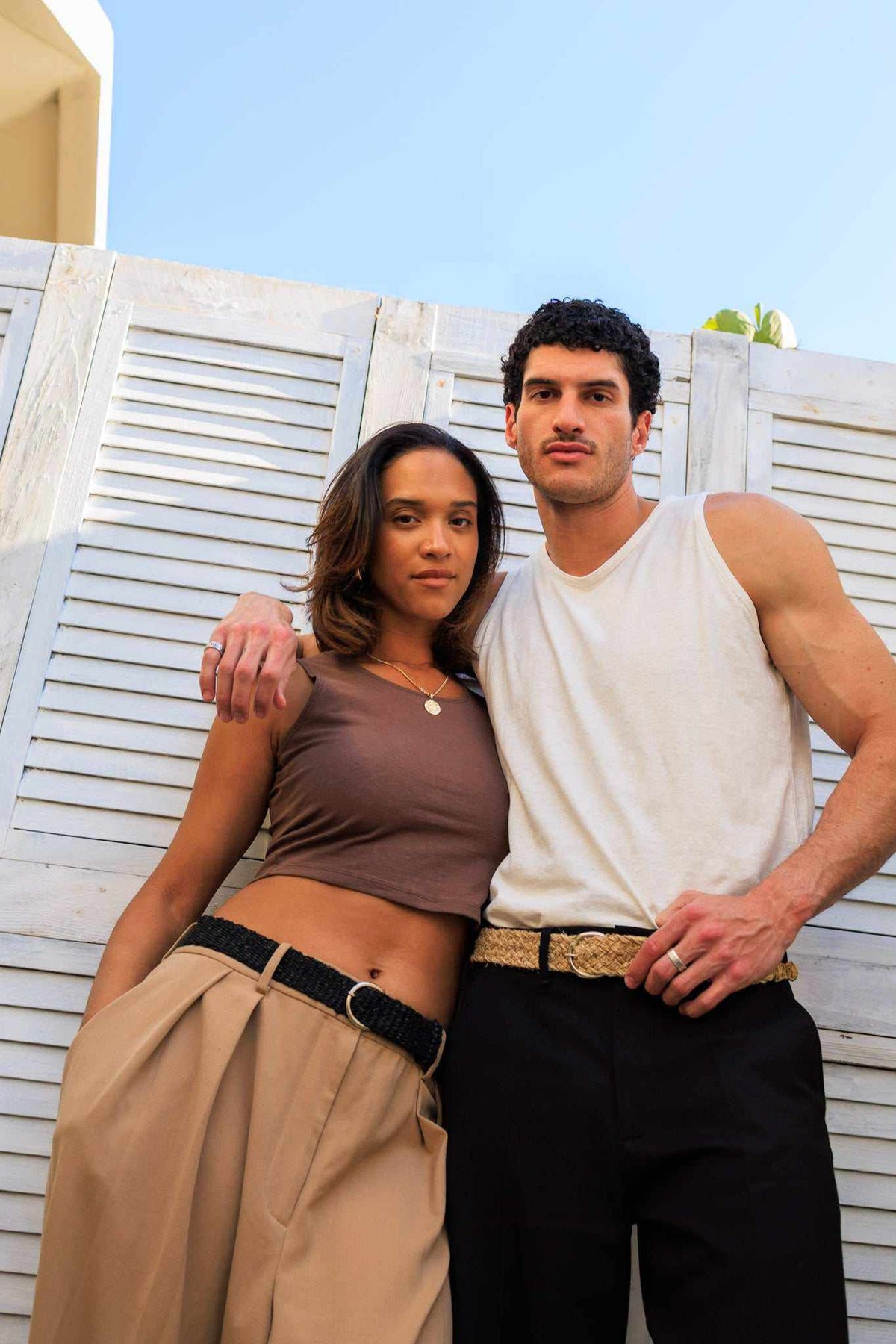 Hemp Tank Top in white, sleeveless with a classic muscle cut and soft jersey texture, worn with dark trousers