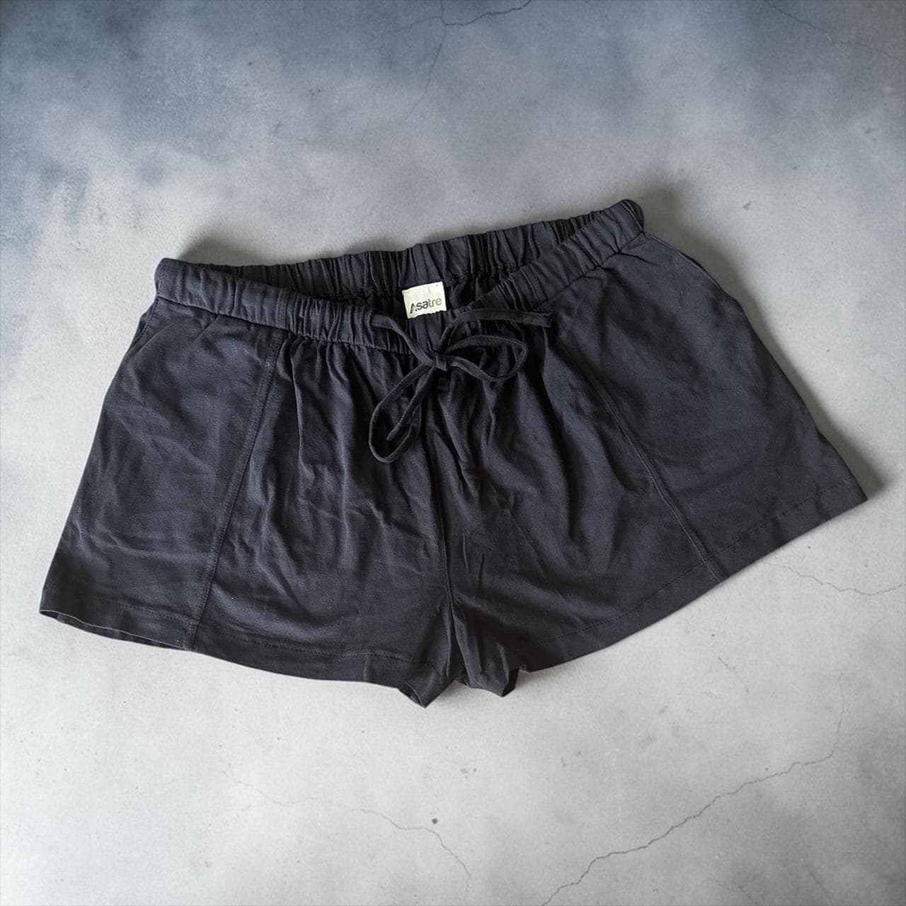 Black women lounge shorts with elastic drawstring waist and deep pockets made from hemp organic cotton blend