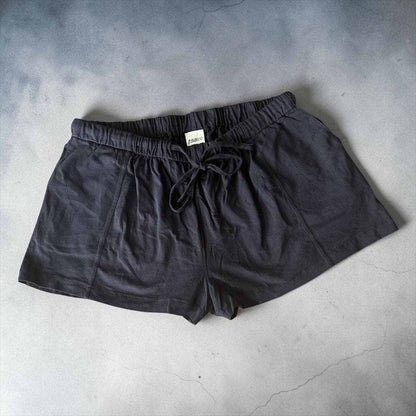 Black women lounge shorts with elastic drawstring waist and deep pockets made from hemp organic cotton blend