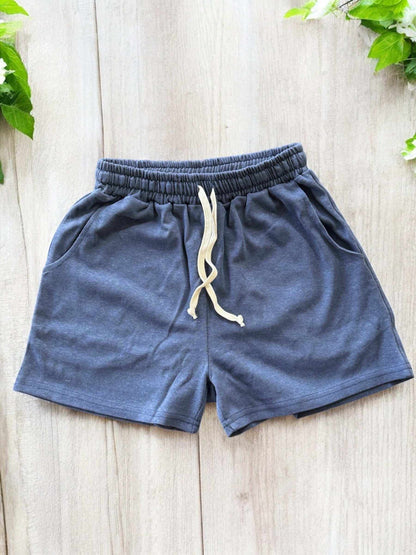 Women's hemp and organic cotton jersey shorts with elastic waist, shown in gray, featuring a drawstring and two hand pockets. Ideal for comfort and sustainability.
