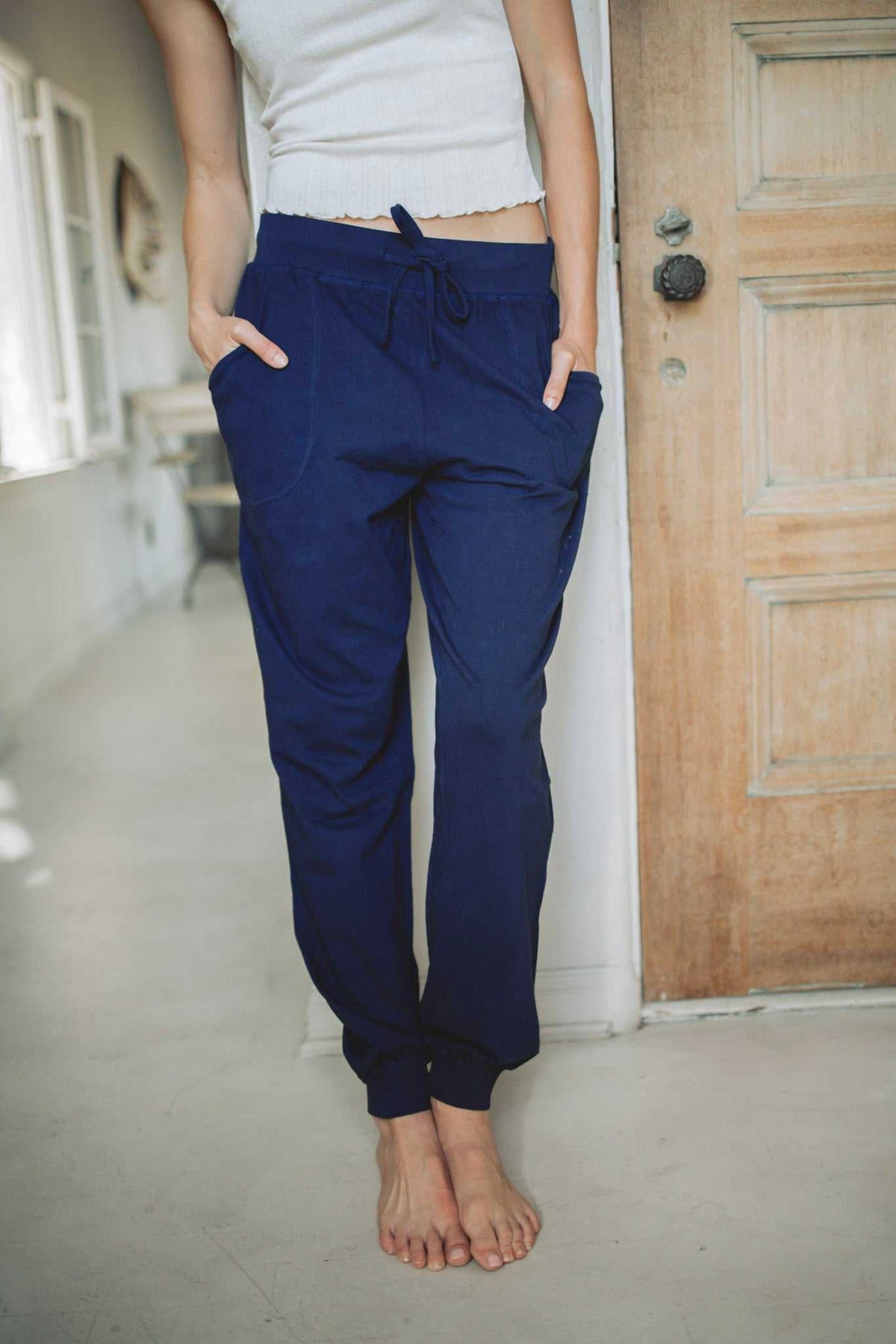 Women’s Hemp Jersey Joggers in navy hemp jersey, featuring a drawstring waist, front pockets, and tapered cuffs
