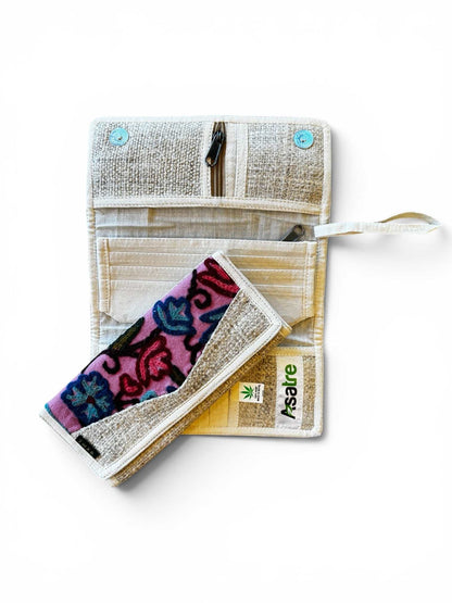 Handmade tri-fold hemp wallet with purple, pink, and green floral embroidery, sustainable vegan bohemian style