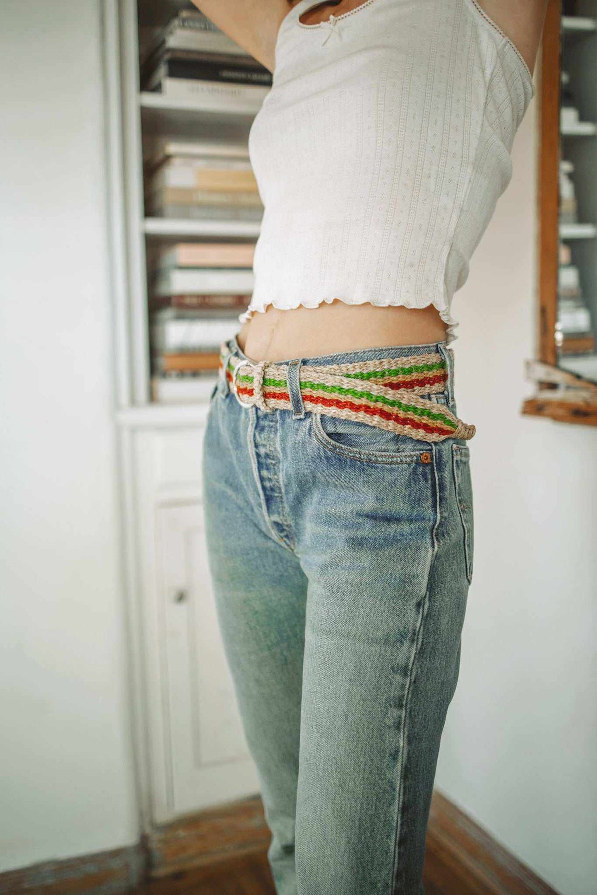 Rasta Belt woven from natural-looking hemp in red, yellow, green and cream stripes, with a metal buckle