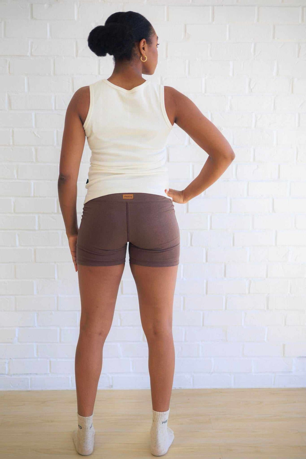 Women's Yoga Shorts in chocolate brown, fitted with a wide yoga waistband and short inseam