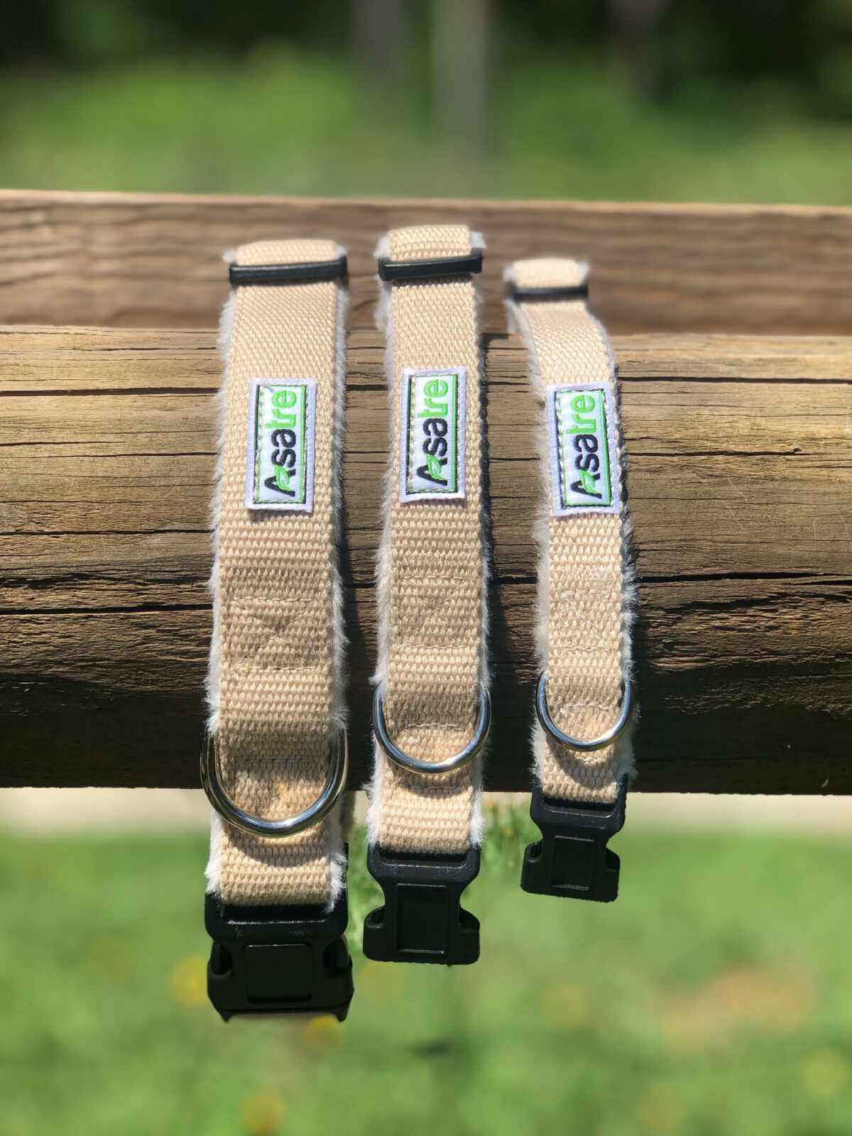 Hemp Dog Collar with beige woven webbing, black plastic buckles and metal D-rings in three adjustable sizes