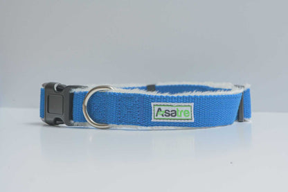 Hemp Dog Collar in bright blue woven webbing, with a soft white lining, black plastic buckle, and metal D-ring