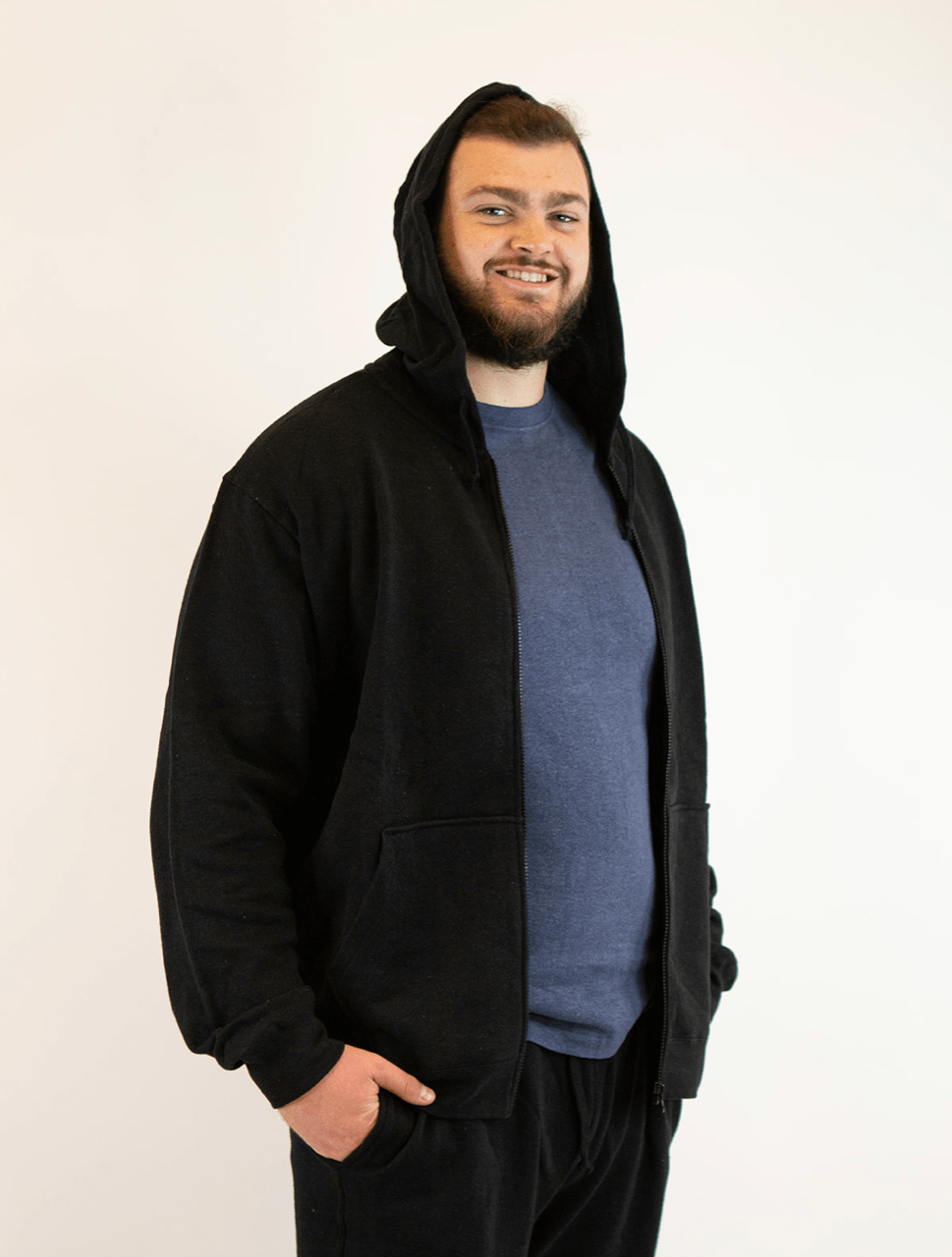 Hemp Hoodie in black hemp and cotton fabric, worn open with a hood, front zipper and split kangaroo pockets