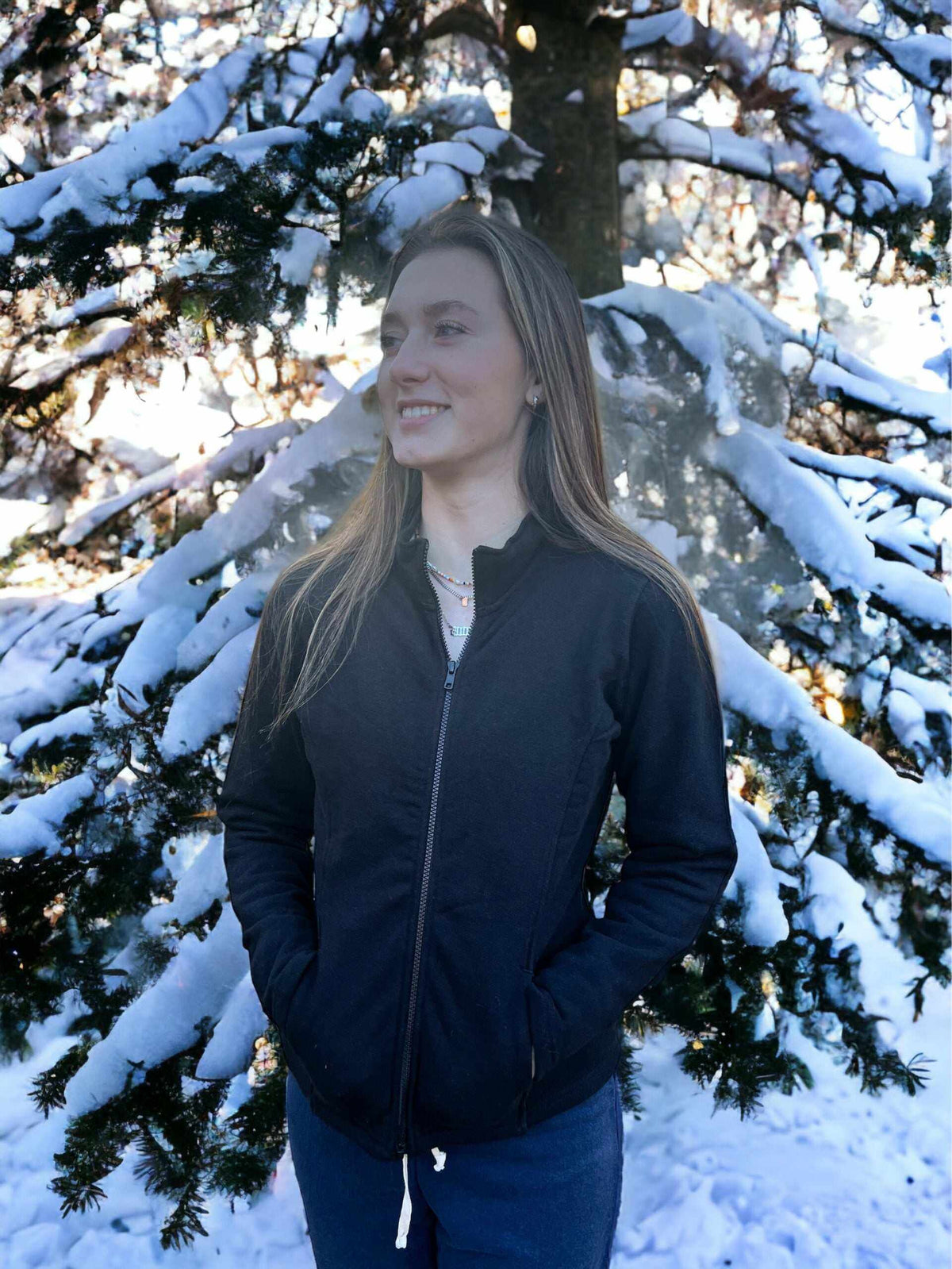 Hemp Jacket in black fleece with a full zip front, stand collar, and vertical pockets, worn by a woman