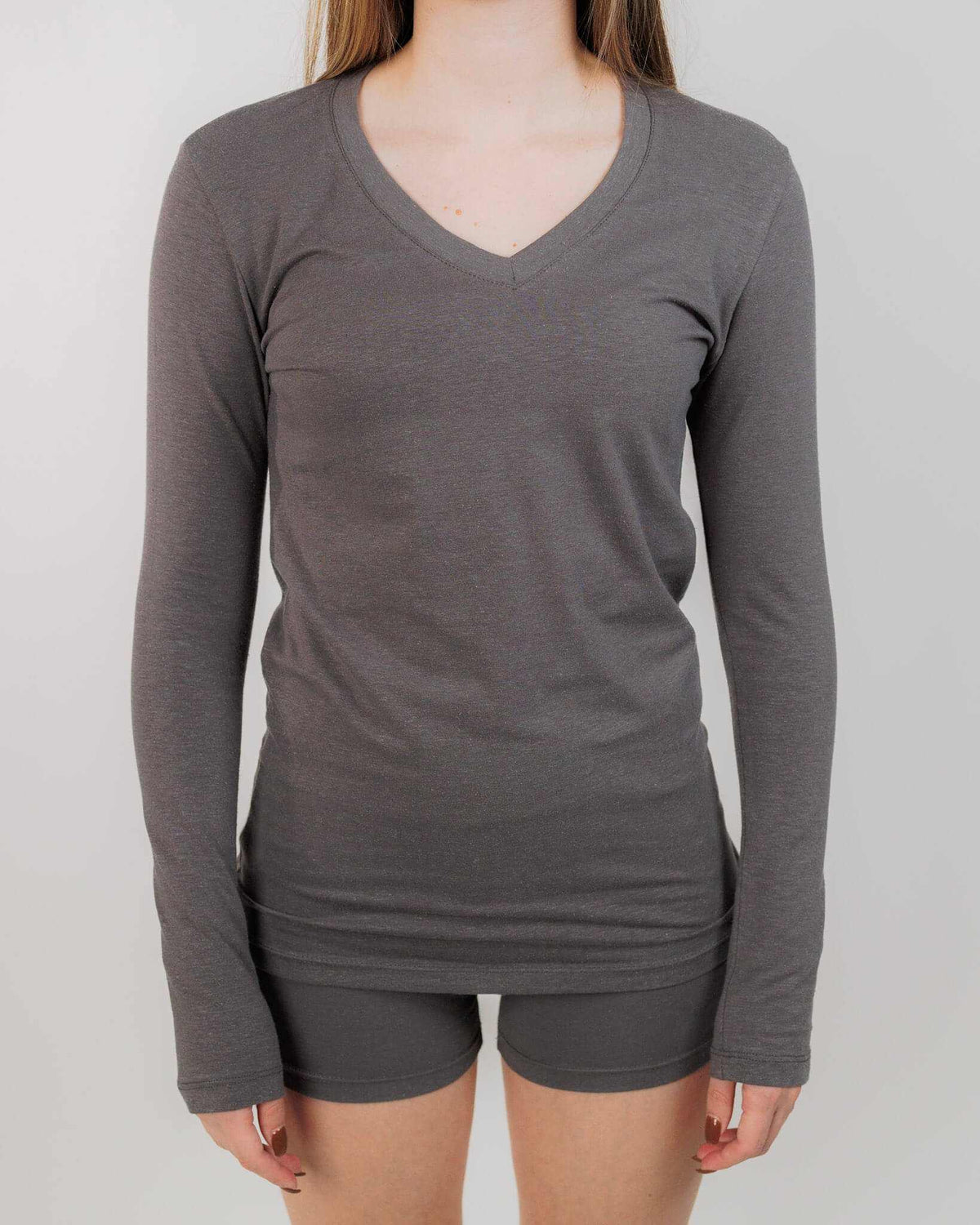 Hemp Shirt in charcoal gray with a soft stretch knit, fitted long sleeves, and a classic V-neck neckline.
