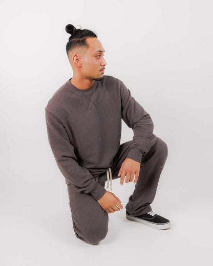 Man wearing brown unisex hemp french terry sweatshirt and matching pants