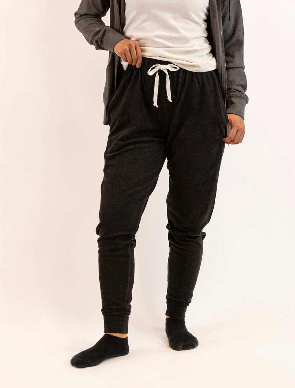 Women wearing black hemp joggers with drawstring waist and relaxed fit